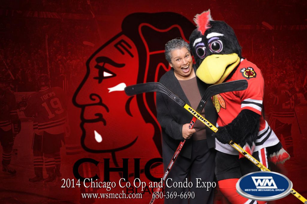 Guest pose with Chicago Blackhawks Tommy Hawk get onsite photo print at Navy Pier tradeshow