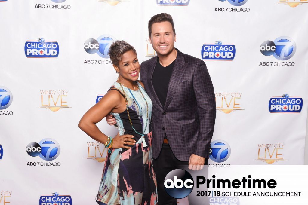 Val Warner and Ryan Chiaverini from ABC7 Windy City Live pose for photos on step and repeat
