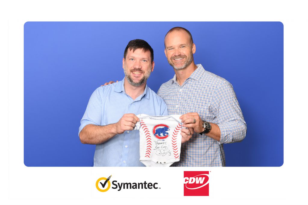 World Champion Chicago Cub David Ross poses with guests and signed onsie