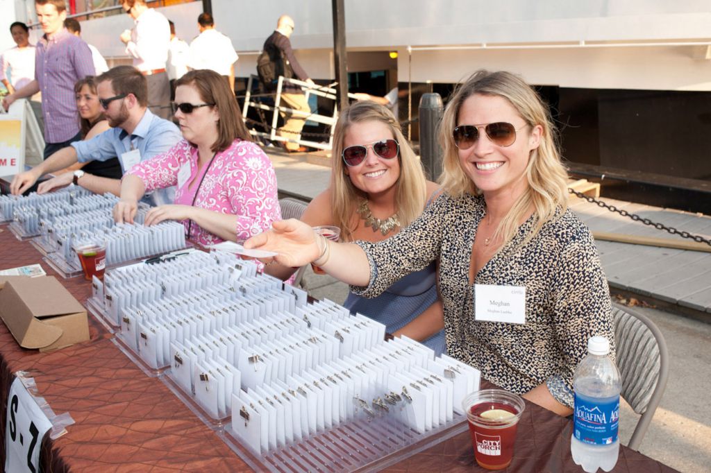 Event photo of registration hosts at boat cruise