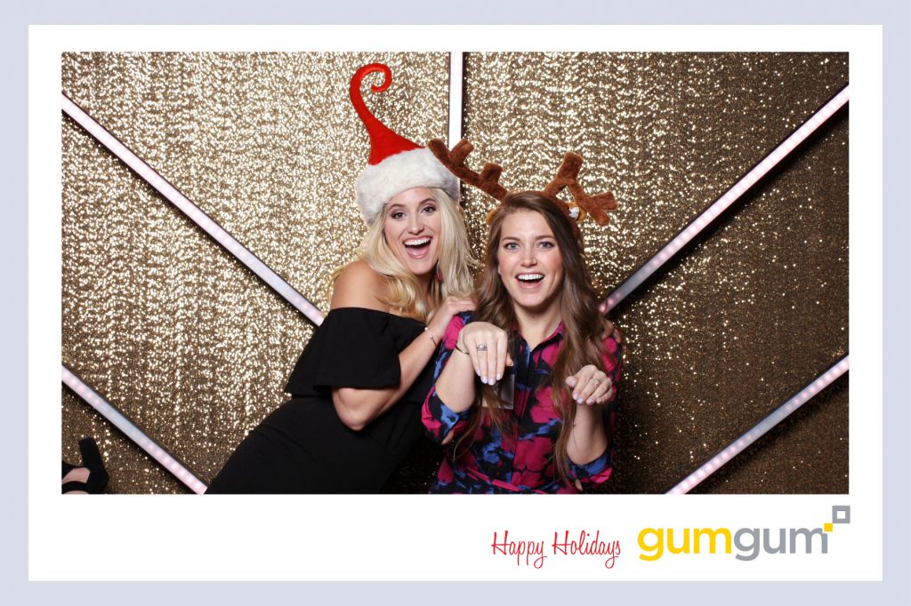 Cutesy reindeer girls enjoy onsite printing and chicago photo booth
