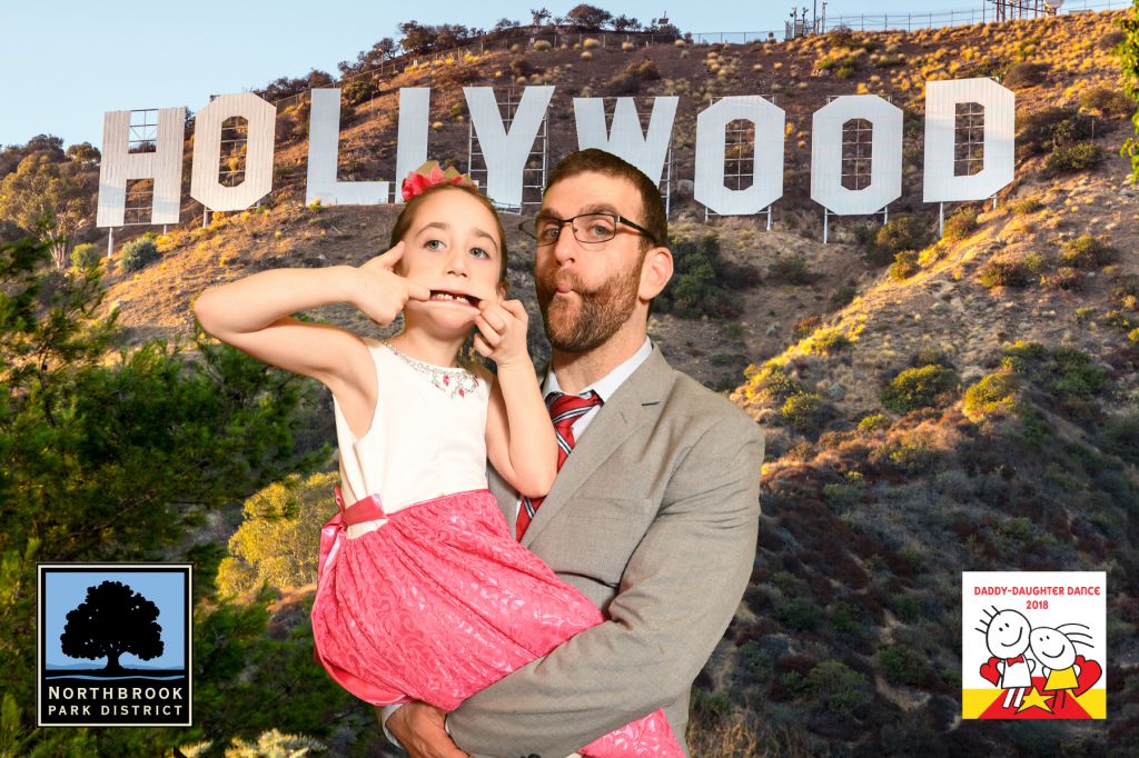 Funny faces in front of Hollywood sign Daddy Daughter couple each get 4x6 photo printed at event