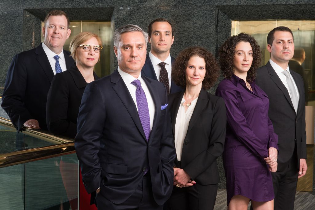 Group photo of Chicago lawfirm looks like cast from a TV show, corporate location photography by Merlo Media