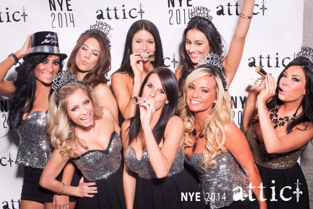 Lovely hostesses pose on New Years Eve step repeat holiday party photography Chicago
