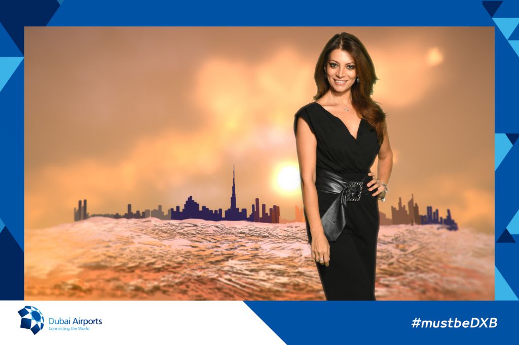 Lovely model posing in the desert with Dubai skyline gets photo print onsite