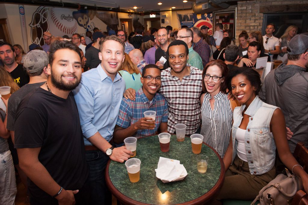 Candid group photo from Cubs rooftop private corporate event, photography by Merlo Media