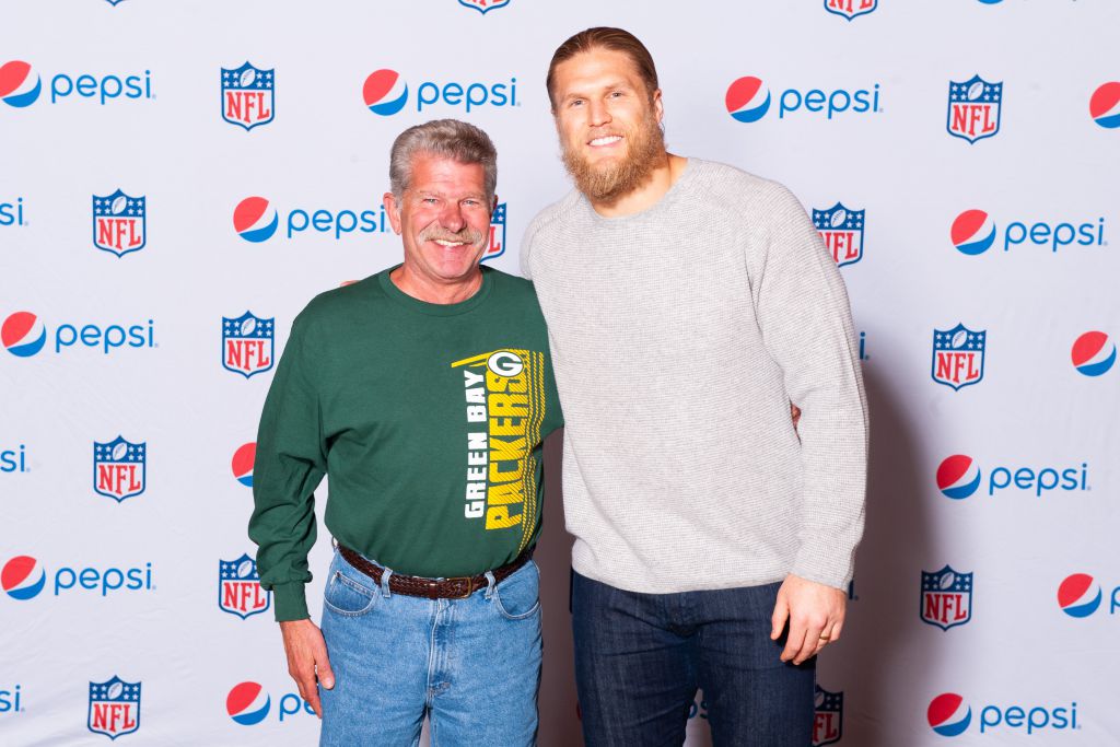 True Green Bay Packers fan poses on the step repeat pepsi background with Clay Matthews