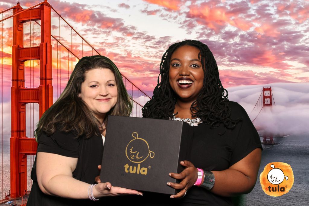 Travel theme green screen photo booth at Baby Tula tradeshow event features Golden Gate Bridge
