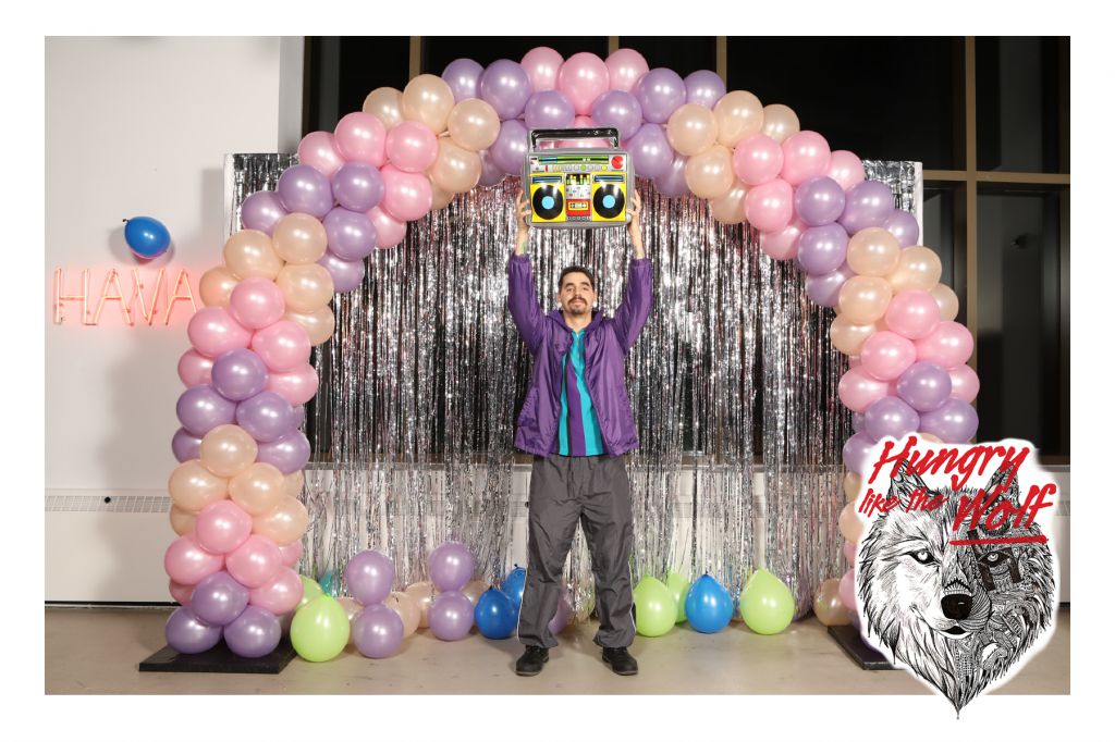 Say Anything Bro at the HAVAS annual holiday party balloon arch photo op