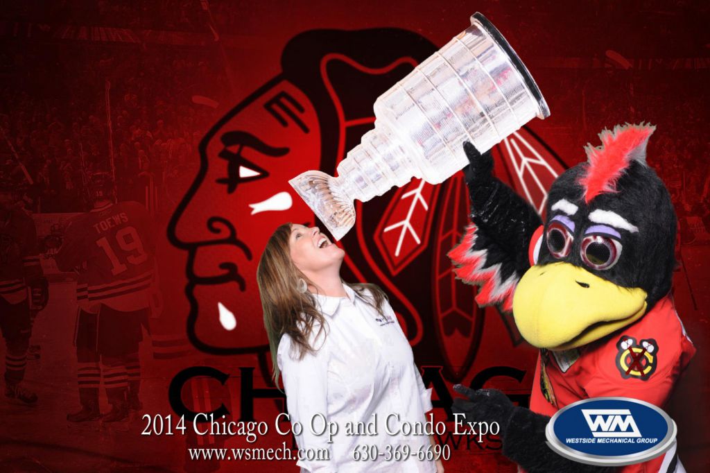 Tommy Hawk pours drink from Stanley Cup into fans mouth at tradeshow for onsite photo print souvenir