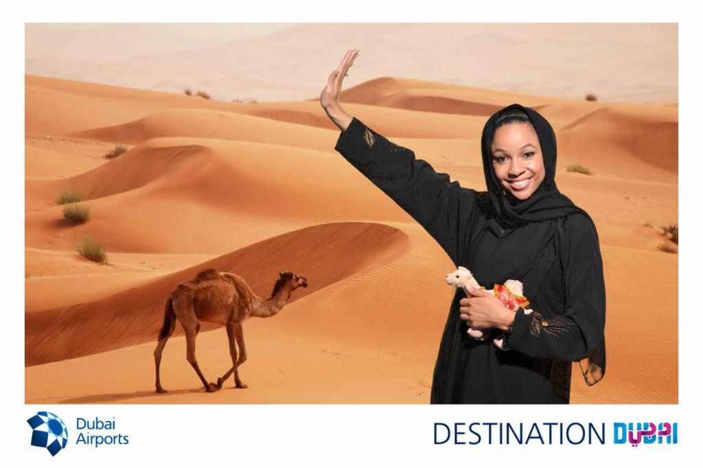 Woman dresses in traditional abaya for Dubai Airports green screen photography at tradeshow